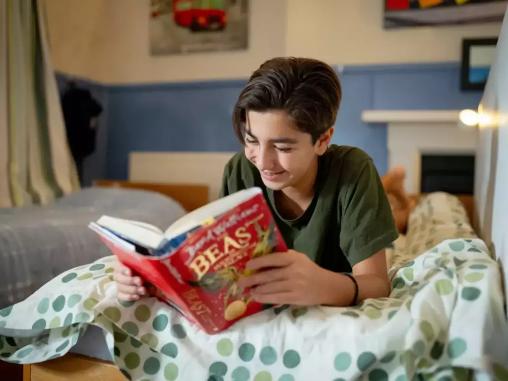 A boarder reading before lights out